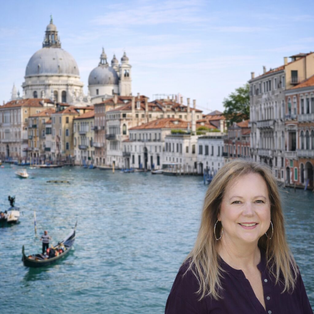 Woman smiling in front of Venice canal.