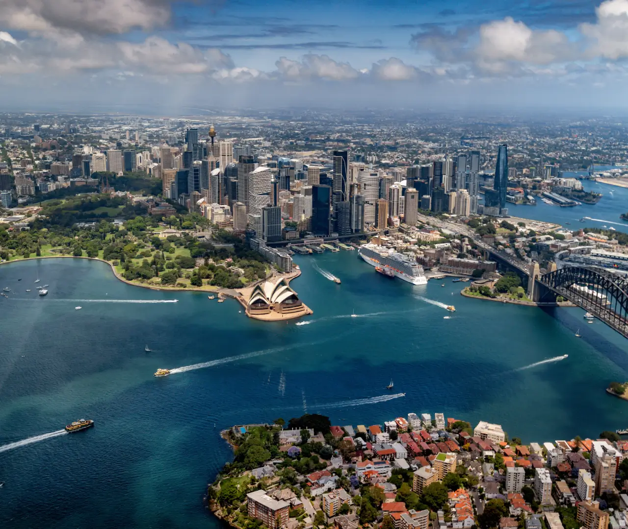 Aerial view of Sydney Opera House and skyline.