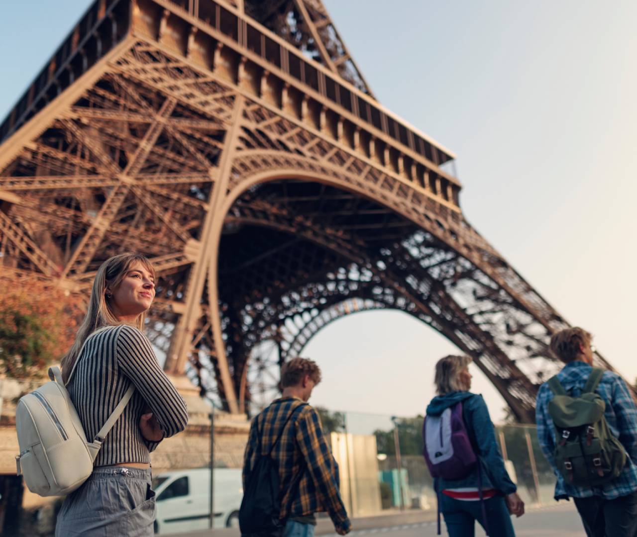 People walking near the Eiffel Tower.