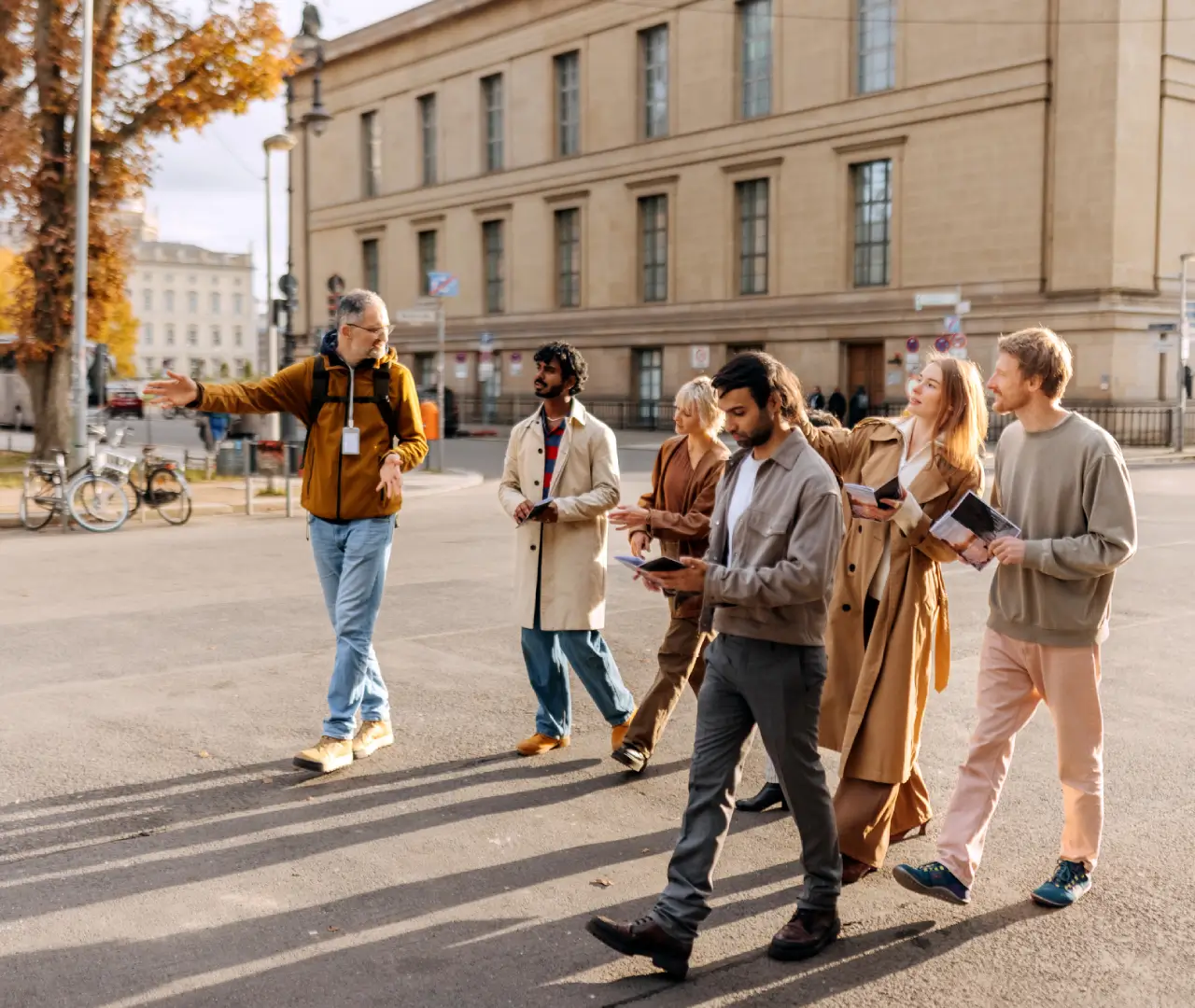Group walking on a sunny urban street.
