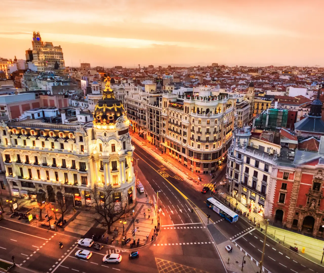 Cityscape with historic buildings at sunset.