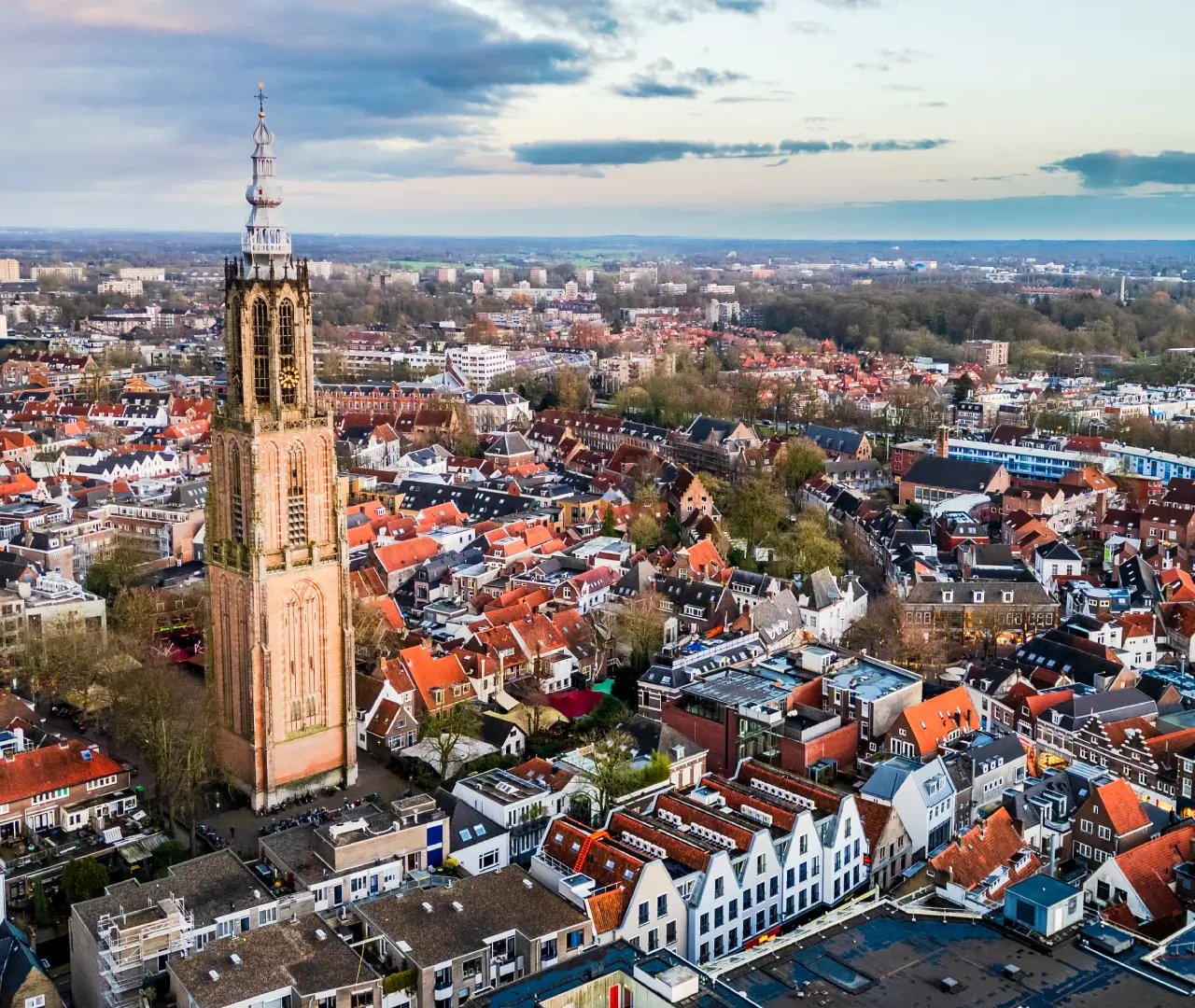 Aerial view of a cityscape with tower.